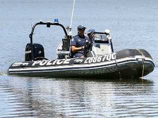 Police search Lake Moogerah as the mystery of the missing woman continues.  . Picture: Claudia Baxter