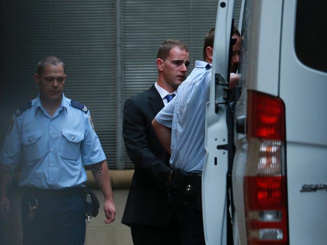 Mitchell Barbieri is led from a corrective services van at the Supreme Court, in Sydney, in 2014. Picture: Britta Campion/AAP