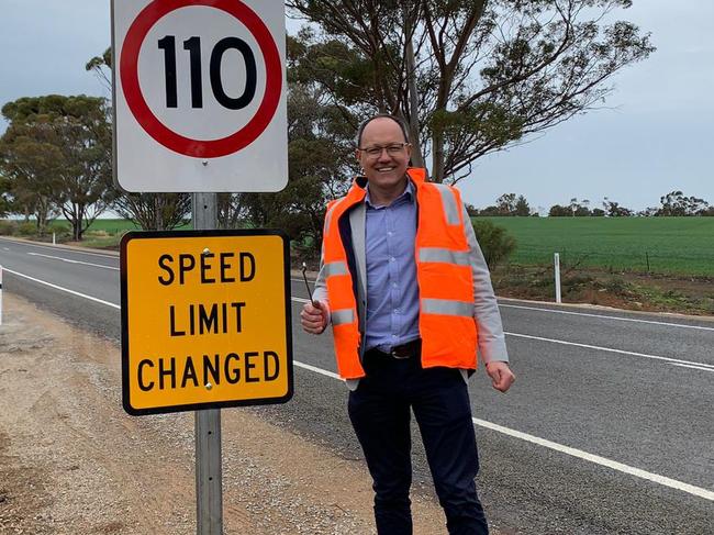 Corey Wingard with a country speed sign  showing 110km/h