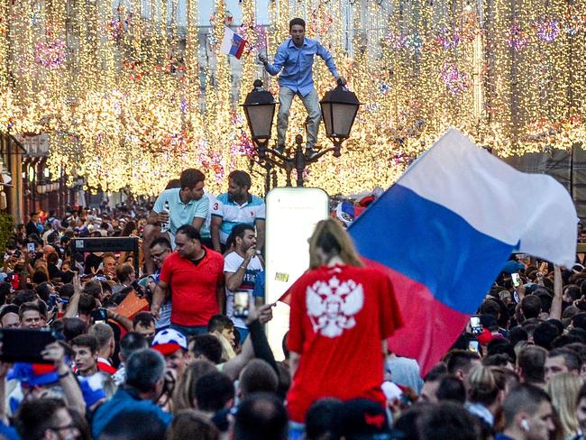 Russia's fans celebrate in central Moscow after their national team beat Spain in the Round of 16. Pic: AFP