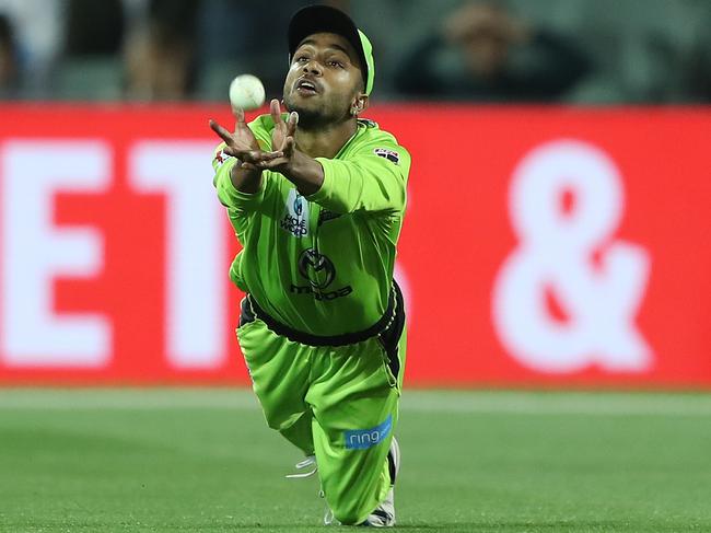 ADELAIDE, AUSTRALIA - FEBRUARY 01: Arjun Nair of the Sydney Thunder takes a catch to dismiss Michael Neser of the Strikers during the Big bash League Finals match between the Adelaide Strikers and the Sydney Thunder at Adelaide Oval on February 01, 2020 in Adelaide, Australia. (Photo by Robert Cianflone/Getty Images)