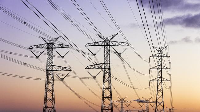 Electricity pylons during dusk evening sky sunset. Energy generic