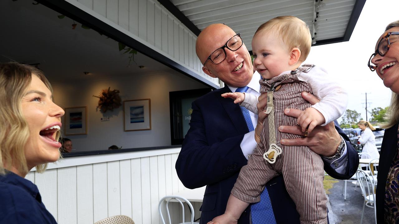 Opposition Leader Peter Dutton meets Shortland electorate candidate Emma King and her baby boy on the campaign trail at Papatya Cafe. Pictures Adam Head / NewsWire