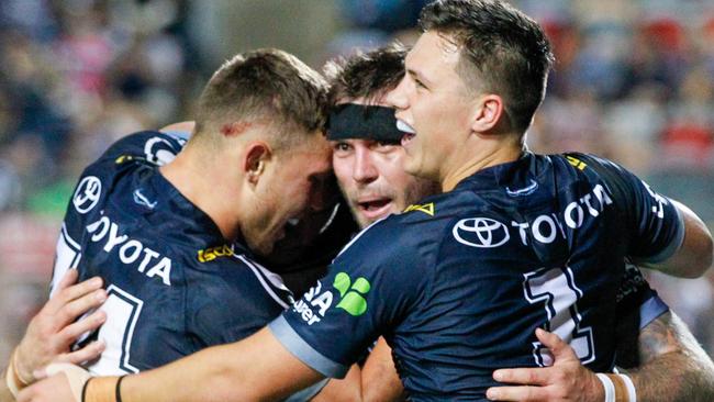 The Cowboys celebrate another Kyle Feldt try. Photo: AAP Image/Michael Chambers