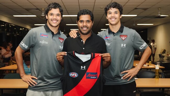 Jayden Davey, Alwyn Davey Sr and Alwyn Davey Jr after the twins were officially selected by the Essendon Bombers in the 2022 AFL Draft. Picture: Essendon Football Club