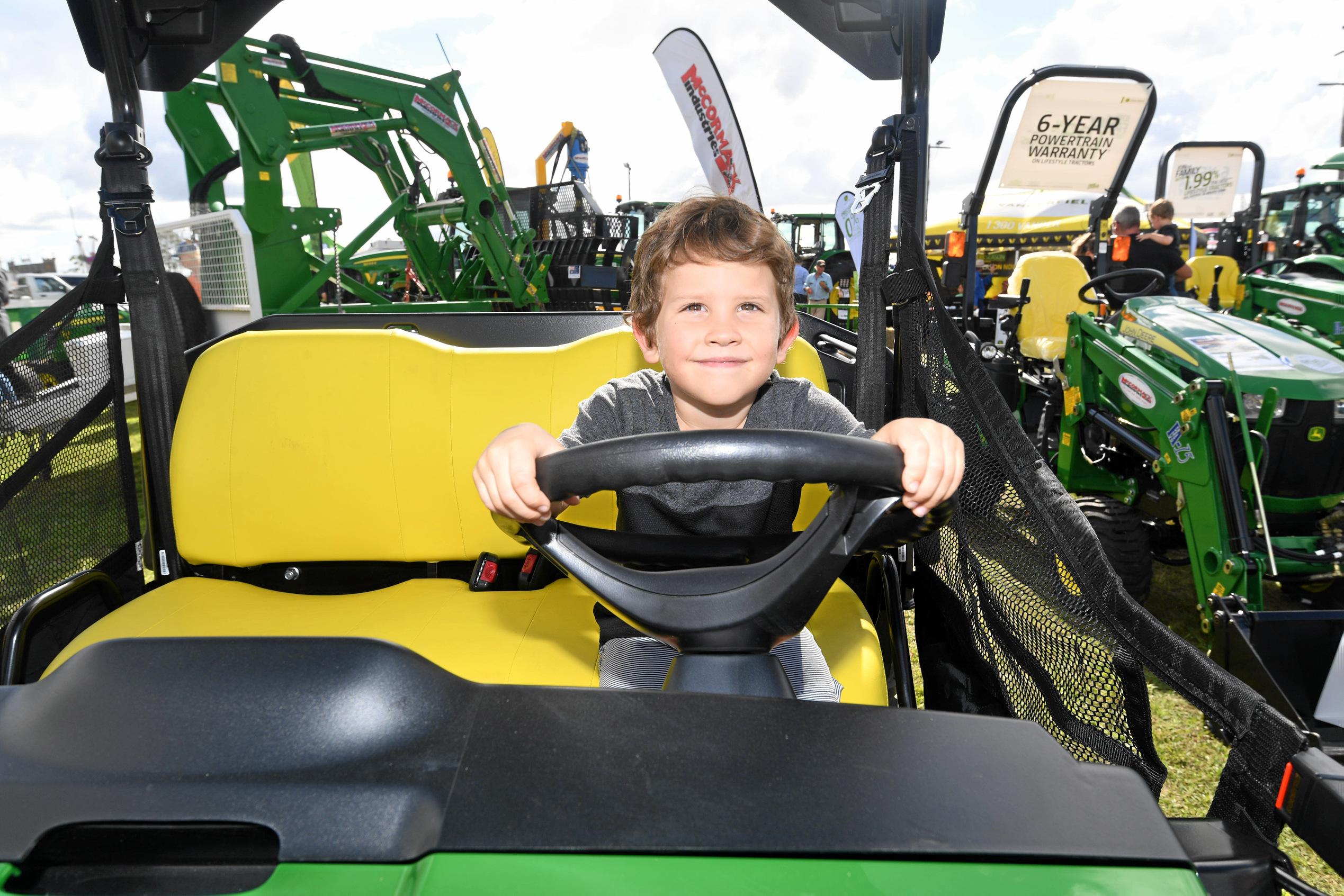 DRIVING FORCE: Jax Riley in Machinery Allley was one of many patrons driving the Gympie Show to success yesterday. Picture: Troy Jegers