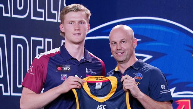 Fischer McAsey (left), pictured with new Crows coach Matthew Nicks, will play for the club for the first time on Saturday. Picture: AAP/Michael Dodge