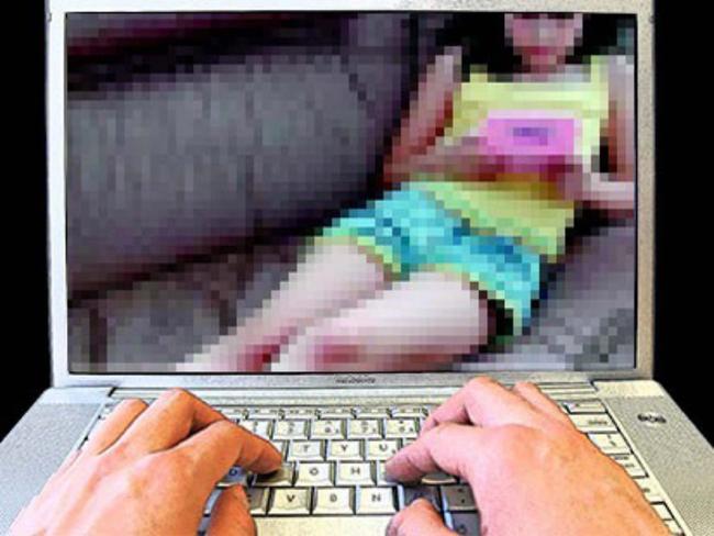 17/04/2009: 17/04/2009: child porn - generic of hands on computer laptop keybord with a photograph of a young child on the screen re: Child sex exploitation. Pic. Supplied MM318424 Pic. Supplied MM318424