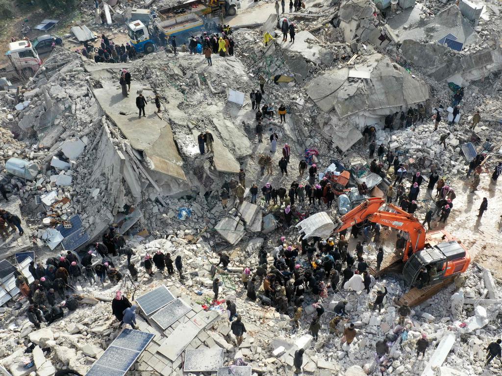 Residents, aided by heavy equipment, searching for victims and survivors amidst the rubble of collapsed buildings following an earthquake in the village of Besnia near the town of Harim, in Syria's rebel-held northwestern Idlib province on the border with Turkey. Picture: AFP