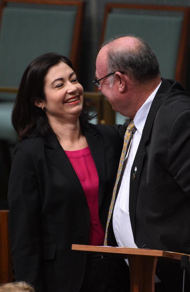 Federal Labor MP Terri Butler hugs National Liberal MP Warren Entsch while waiting to introduce the same-sex marriage bill in the House of Representatives. Source: AAP