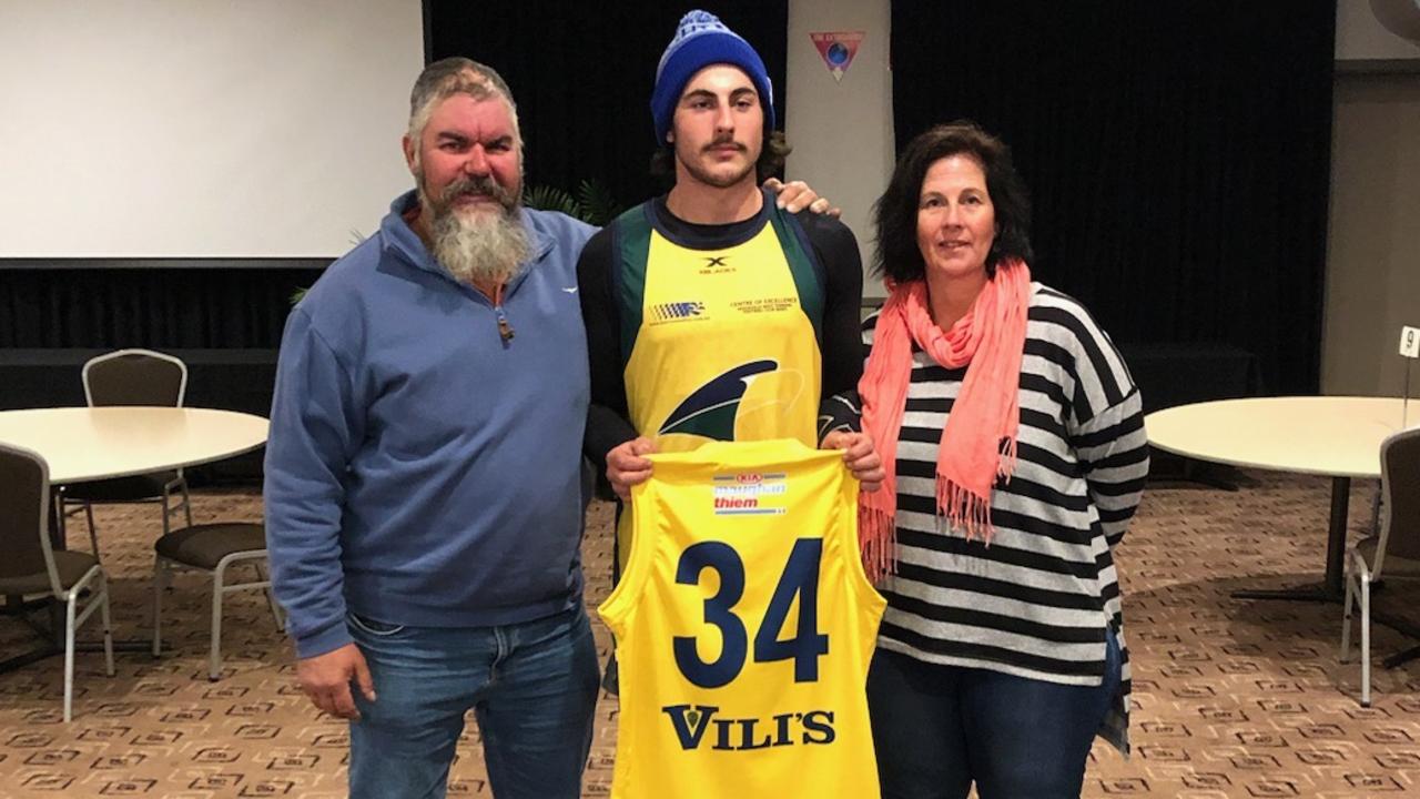 Ben, Lachie and Vicki Jones after Lachie was presented with his Eagles guernsey in the SANFL Picture: Supplied