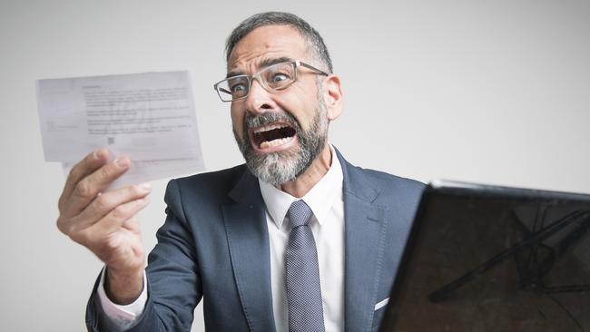 Furious business man shocked and angry with expensive bills he receives at his office, electricity money generic