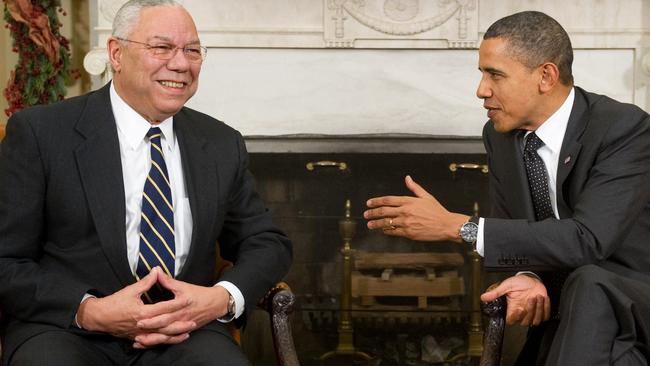 Then President Barack Obama speaks with former US Secretary of State General Colin Powell (L) during a meeting in the Oval Office. Picture: AFP.