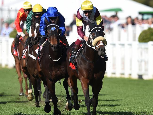 Jockey Hugh Bowman (right) rides Index Linked to win race 6, the Tattersal's Cup Handicap during the Tattersal's Race Day at Eagle Farm racecourse in Brisbane, Saturday, June 25, 2016. (AAP Image/Dan Peled) NO ARCHIVING, EDITORIAL USE ONLY