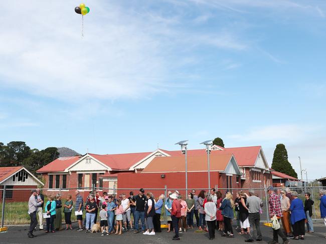 Residents against the proposed plans for redevelopment of the old Claremont primary school site with balloons at the height of the planned complex. Picture: Nikki Davis-Jones