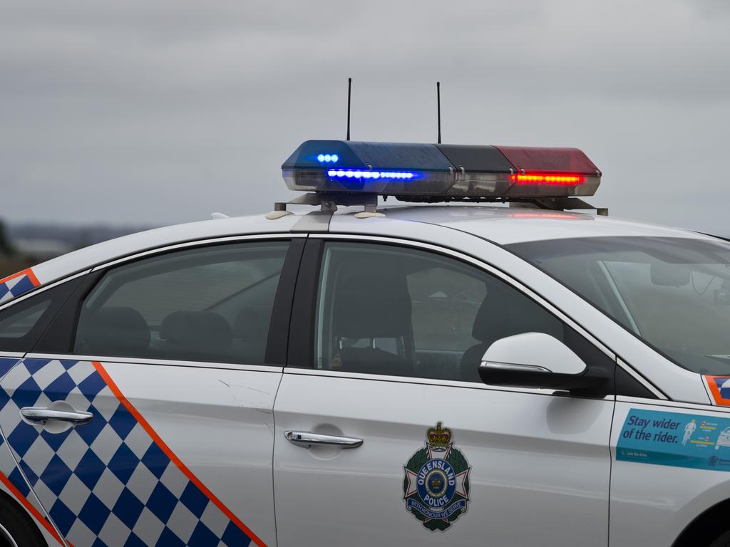 A QPS police car on the Warrego Highway near Oakey where a truck rolled spilling its contents and blocking traffic, Thursday, July 9, 2020. Picture: Kevin Farmer