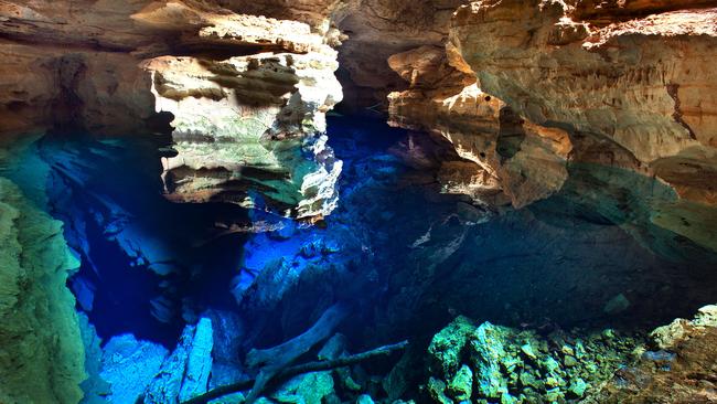 PIC FROM CATERS NEWS - (PICTURED: The incredible pool in Brazil ) - At first glance, youd be forgiven for thinking the wondrous cave was just an empty bottomless pit. But do a double take and youll actually find the depths of the Poo Azul cavern, in Chapada Diamantina National Park, Brazil, have actually been flooded with a mystical INVISIBLE POOL. Photographer Marcio Duranc, 40, captured the sheer magnificence of the vast, 16m deep underground cave, which was discovered by a prospector in 1920 when looking for diamonds in the region. SEE CATERS COPY.