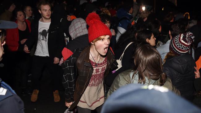 Protesters face off with police.