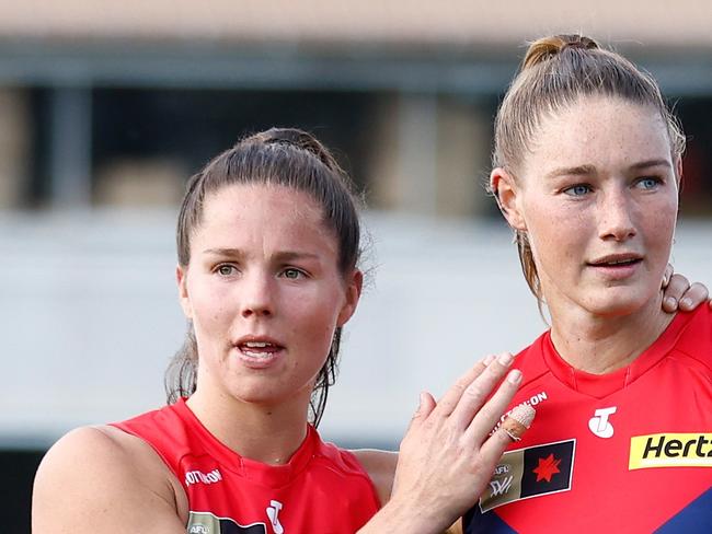 MELBOURNE, AUSTRALIA - NOVEMBER 12: Kate Hore (left) and Tayla Harris of the Demons look dejected after a loss during the 2023 AFLW Second Qualifying Final match between The Melbourne Demons and The North Melbourne Tasmanian Kangaroos at IKON Park on November 12, 2023 in Melbourne, Australia. (Photo by Michael Willson/AFL Photos via Getty Images)