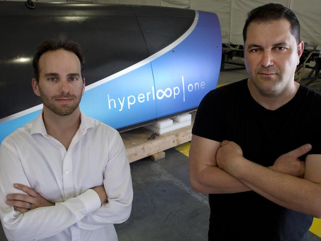 Sherrin Pishevar (R), co-founder and Executive Chairman of Hyperloop and Josh Giegel Co-Founder and President of Engineering pose with the first Prototype of Hyperloop One Pod on July 12, 2017.