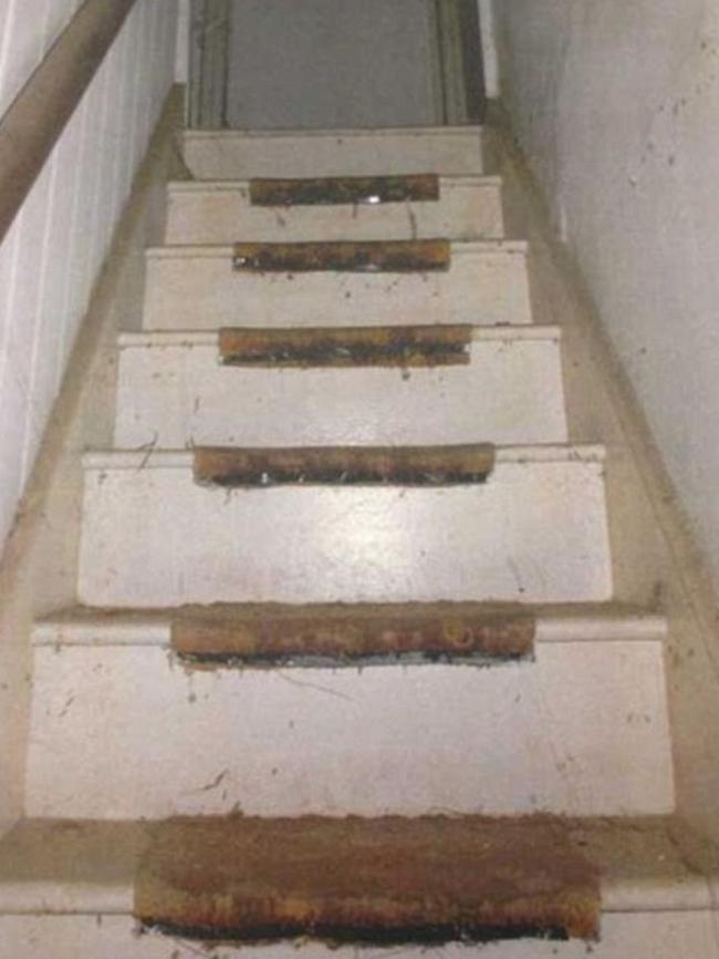 Worn stairs in Natalie Wood’s unit lie covered in dust. Picture: NSW Coroner's Court