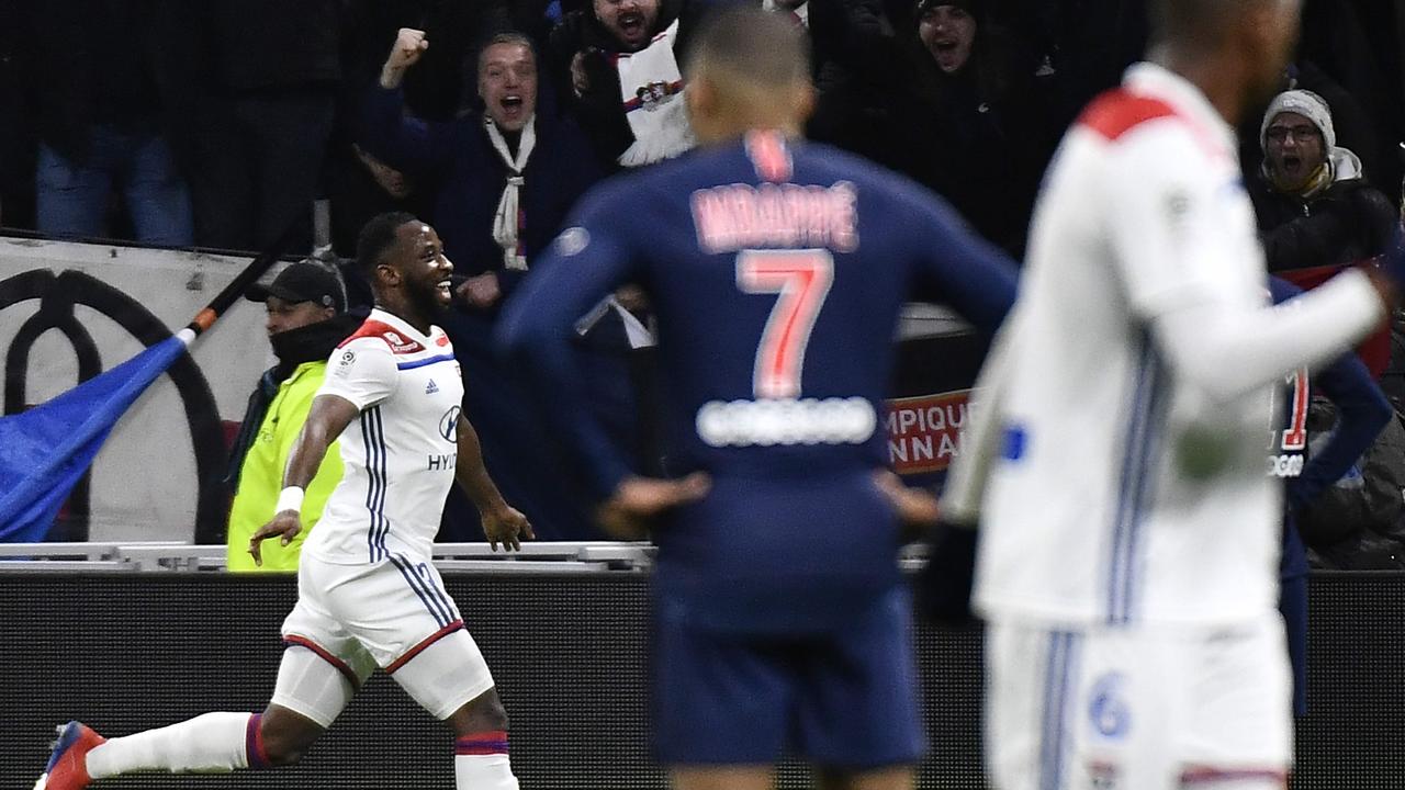 Lyon's French forward Moussa Dembele (L) jubilates after scoring a goal