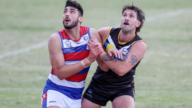 WRFL: Paul Tsapatolis of Point Cook battles Liam Read of Caroline Springs. Picture: George Sal