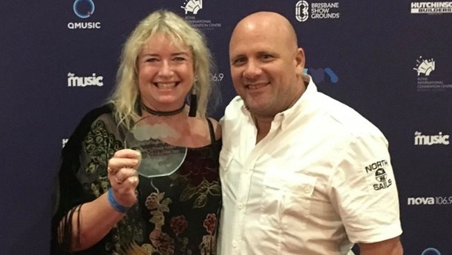 NightQuarter owners Michelle Christoe and Ian van der Woude with their award at the Queensland Music Awards.