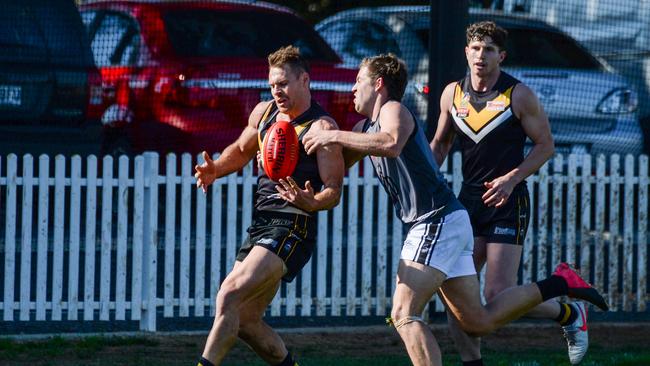 AUGUST 21, 2021: PortÃ&#149;s Luke McInerney tackles BrightonÃ&#149;s Nigel Osborn during Adelaide Footy League division one match between Brighton Bombers and Port District at Brighton Oval. Picture: Brenton Edwards