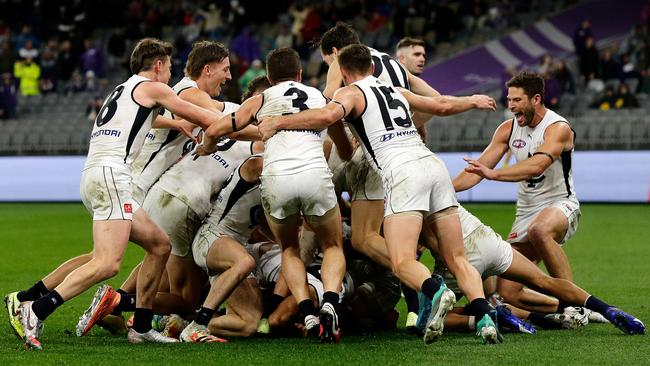 The Blues pile on top of the matchwinner. Picture: AFL Photos/Getty Images