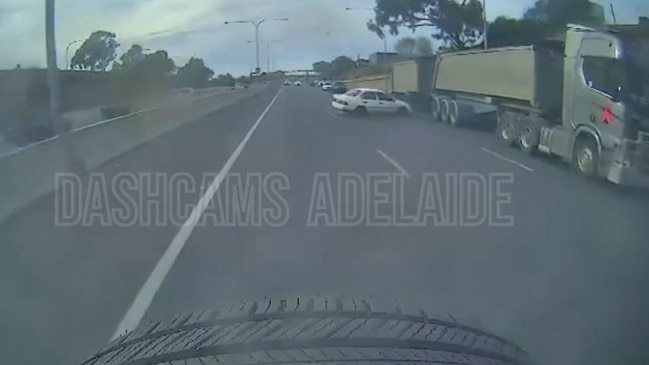 A video shows the moment a car nearly goes under the wheels of a B-double on the Southern Expressway at Darlington. Picture: Dashcams Adelaide