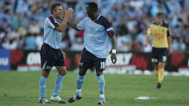 Steve Corica celebrates with Dwight Yorke after scoring in the 2006 A-League grand final.