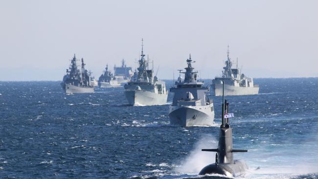 Submarine HMAS Farncomb sails with Navy ships from around the Indo Pacific region during the Japan Maritime Self-Defense Force's International Fleet Review 2022 off Yokosuka, Japan.