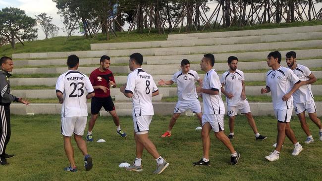 The Palestinian warm up before last year’s Asian Games.