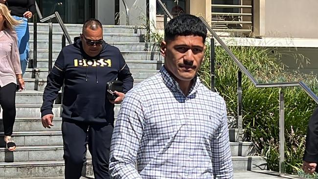 St George Illawarra Dragons player Junior Amone (front) and his father Talatau Amone leaving Wollongong Local Court on Wednesday. Picture: Dylan Arvela