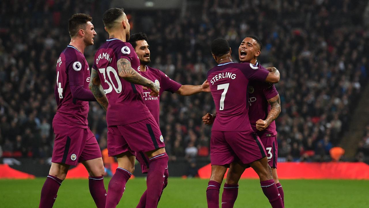 Manchester City's English midfielder Raheem Sterling (2nd R) celebrates with Manchester City's Brazilian striker Gabriel Jesus (R) and teammates after scoring their third goal