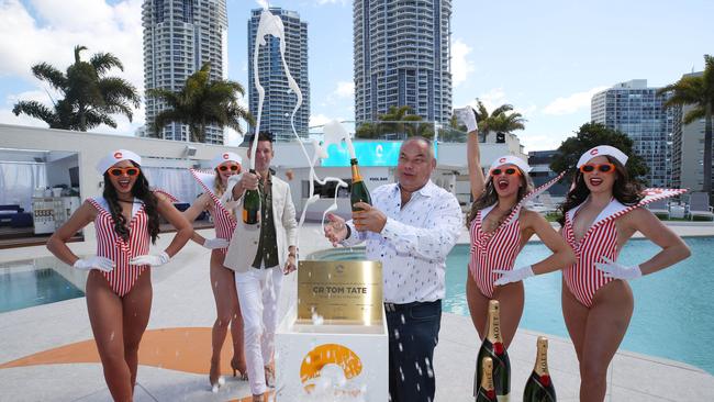 Opening of Cali Beach Club. Official opening by the Artesian Group’s Matt Keegan and Mayor Tom Tate unveiling the plaque then spraying champagne with the Cali Beach Girls. Picture: Glenn Hampson.