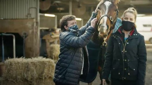 Melbourne Cup winning jockey Michelle Payne and her brother Stevie in the ad. Image: Screen grab/Victorian Government