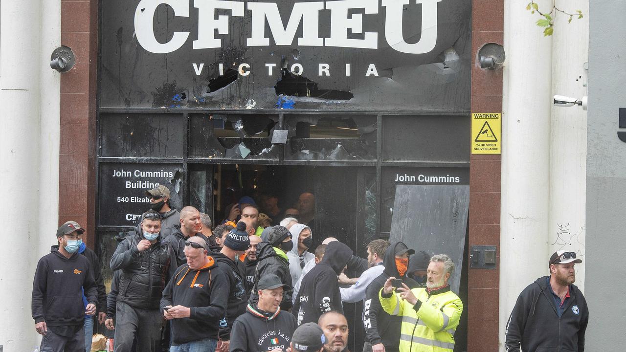 People gather outside a damaged CFMEU head office. Picture: Rob Leeson