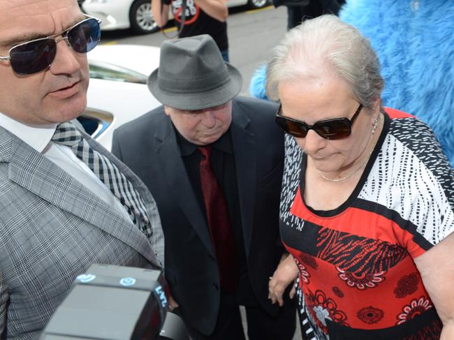 Child sex predator Vivian Deboo and his wife Margaret, arrive at the District Court surrounded by protesters and supporters of his victims on November 28. Picture: AAP Image/ Brenton Edwards