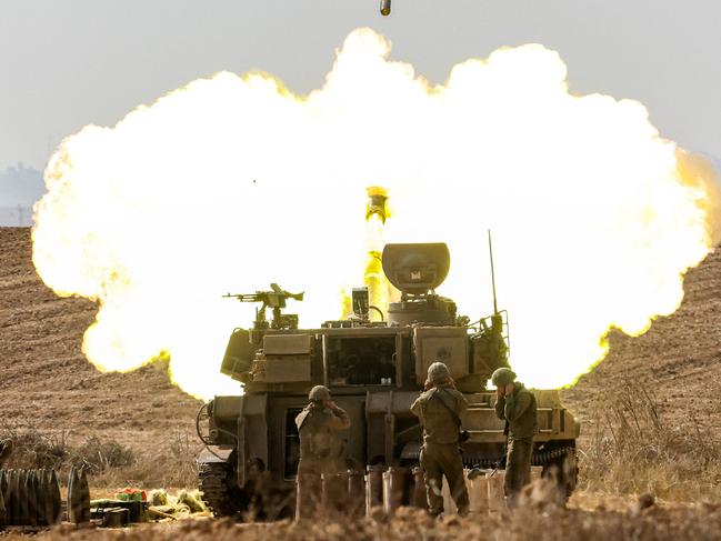 (FILES) An Israeli army M109 155mm self-propelled howitzer fires rounds near the border with Gaza in southern Israel on October 11, 2023. Hamas's attack on October 7 resulted in the deaths of 1,205 people on the Israeli side, most of them civilians, according to an AFP tally based on Israeli official figures. Israel's retaliatory military campaign in Gaza has killed at least 41,431 Palestinians, the majority of them civilians, according to figures provided byÂ the health ministry in Hamas-run Gaza. The United Nations hasÂ acknowledged the toll as reliable. (Photo by JACK GUEZ / AFP)