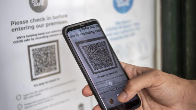 A person signs into a Bondi cafe using a QR code. Picture: Monique Harmer