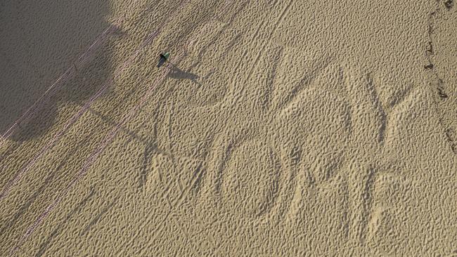 Social distancing measures at places like beaches have been largely successful. Picture: Brook Mitchell/Getty Images