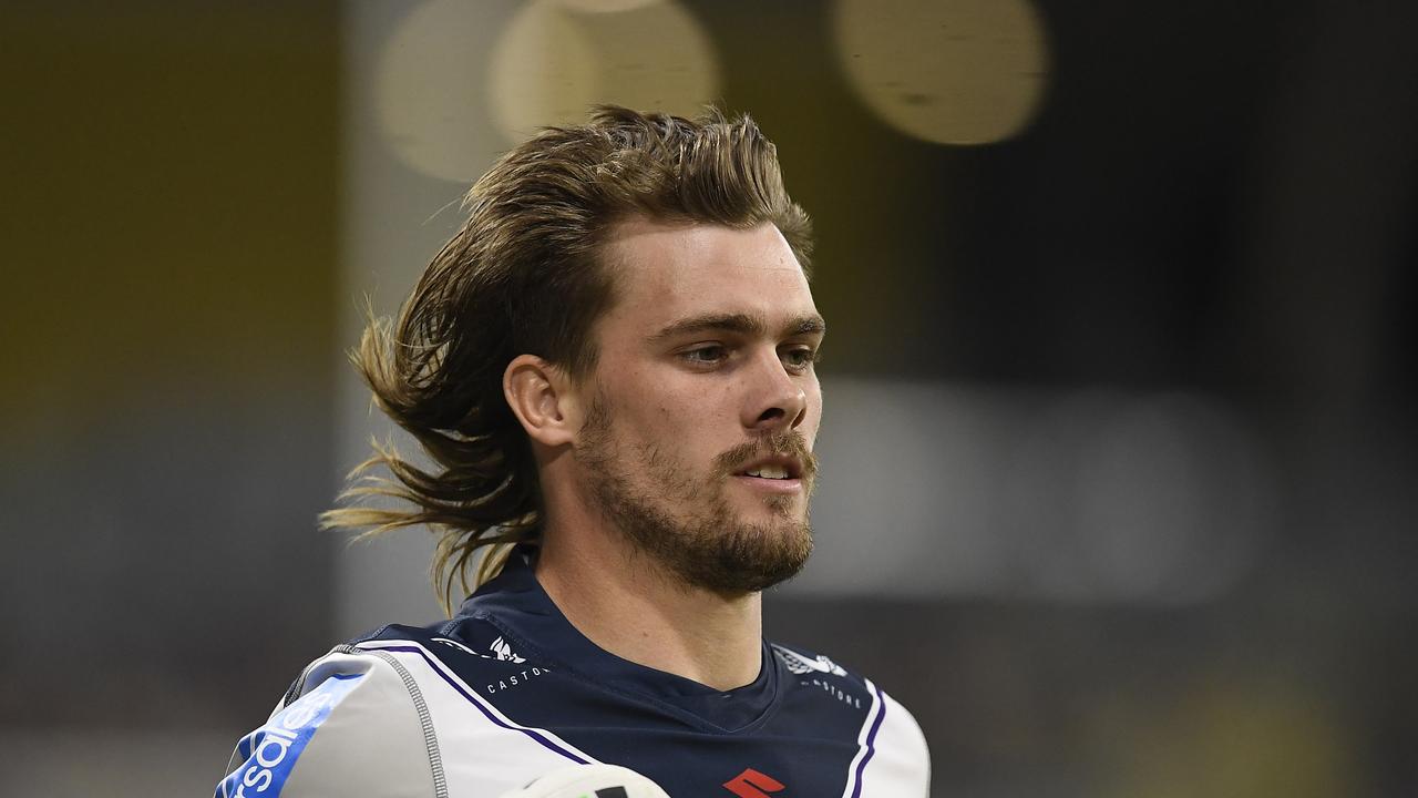 TOWNSVILLE, AUSTRALIA - JULY 23: Ryan Papenhuyzen of the Storm warms up on the sideline during the round 19 NRL match between the North Queensland Cowboys and the Melbourne Storm at QCB Stadium, on July 23, 2021, in Townsville, Australia. (Photo by Ian Hitchcock/Getty Images)