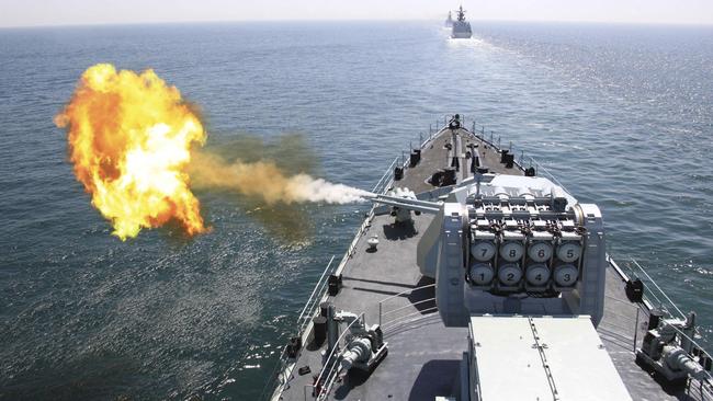 A Chinese navy missile destroyer fires a shell during joint naval exercises in the Yellow Sea. Picture: AP