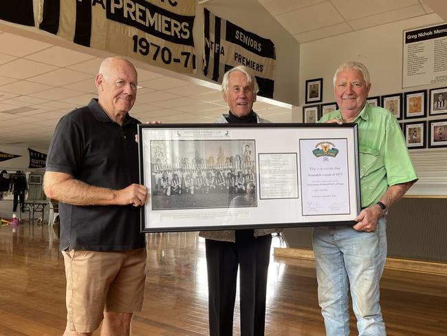 Scottsdale Magpies 1973 coach Bob Wilson (middle) with state championship-winning players Steve Nichols (left) and Danny Hall (right) at Scottsdale Football Club on Monday.