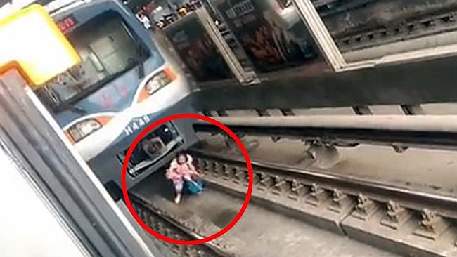 Train runs over woman - she lives