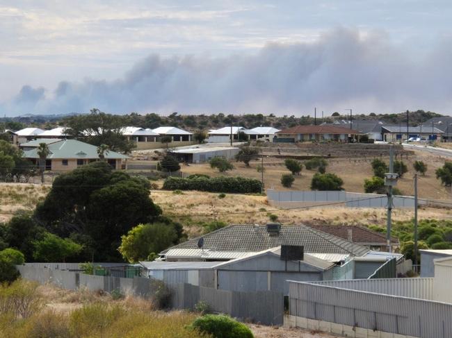 Residents in the Irwin, Mount Adams, Mount Horner and Yardarino in WA's Mid West have been told to leave now as fires burn on the edge of the town of Dongara. Here, smoke can be seen billowing from a home in Dongara on Saturday. Picture: Supplied