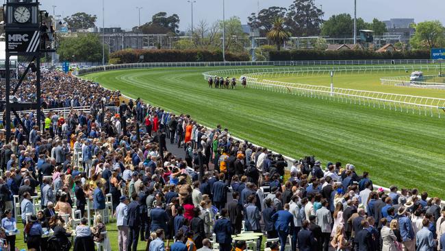 A massive crowd enjoys Caulfield Cup Day in Melbourne. Picture: Jason Edwards