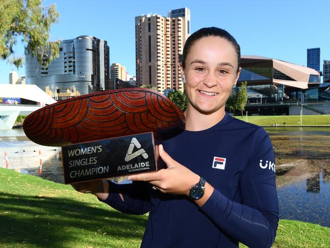 ADELAIDE, AUSTRALIA - JANUARY 09: Ashleigh Barty of Australia  holds the Womens Singles Champion trophy after defeating Elena Rybakina of Kazakhstan at Pinky Flat on the River Torrens during day eight of the 2022 Adelaide International at Memorial Drive on January 09, 2022 in Adelaide, Australia. (Photo by Mark Brake/Getty Images)